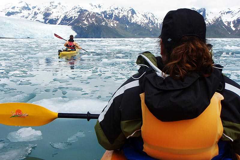 kenai-fjords-national-park-a-group-of-kayakers-approach-aialik-galcier-in-aialik-bay