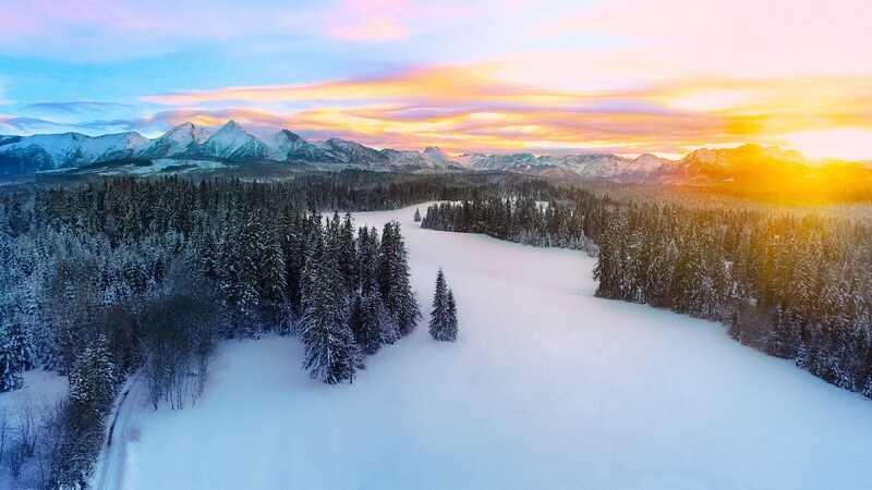 Aerial view of winter mountain panorama and colorful sky. Tatra mountains and magical unspoiled scenery © Bernadetta Sarat  Dreamstime.com_