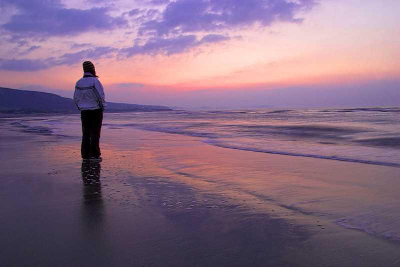pensarn-abergele-beach-a-person-on-an-empty-late-evening-beach-north-wales-uk