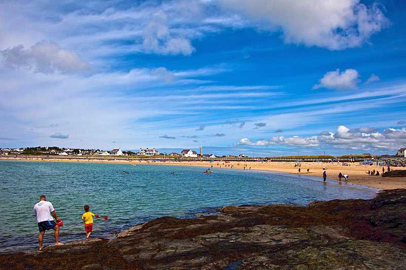 trearddur-bay-beach-trearddur-bay-and-a-father-and-son-look-for-the-perfect-place-for-a-sandcastle