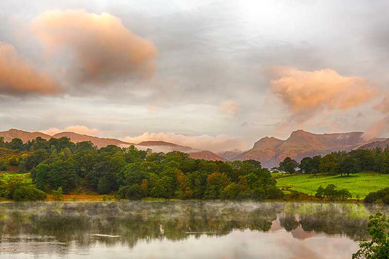 loughrigg-tarn-sun-rising-and-illuminating-langdale-pikes-with-loughrigg-tarn-in-foreground